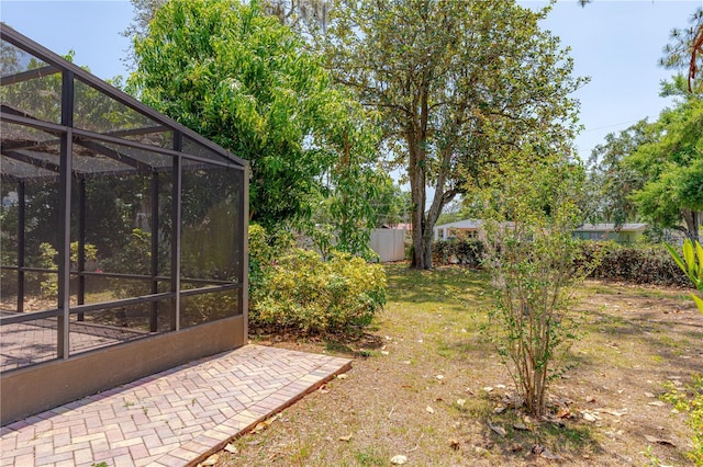 1108 Gibson St, Leesburg, FL 34748 - view of yard featuring fence and glass enclosure