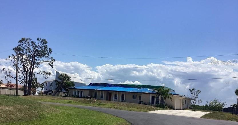 3360 Peace River Dr, Punta Gorda, FL 33983 - single story home with driveway and a front lawn