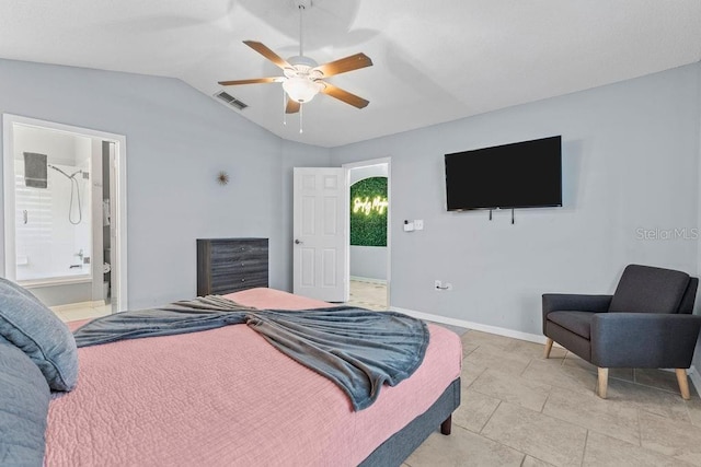 bedroom with visible vents, lofted ceiling, baseboards, ensuite bathroom, and ceiling fan