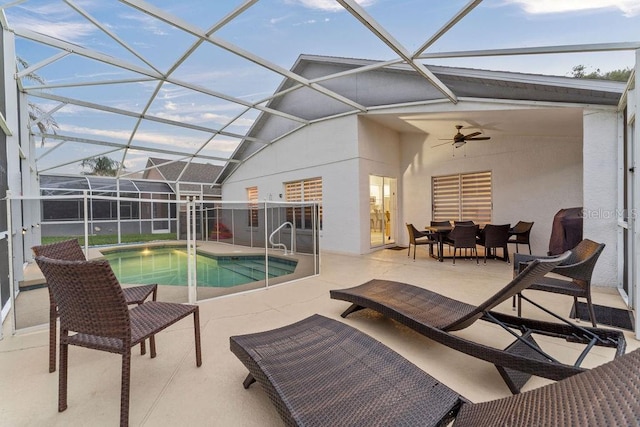 pool with a patio, ceiling fan, and a lanai