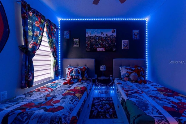 bedroom with tile patterned floors and a ceiling fan