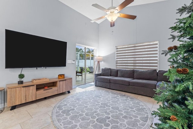 living room featuring light tile patterned floors, high vaulted ceiling, and ceiling fan