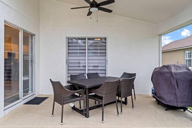 view of patio featuring grilling area, a ceiling fan, and outdoor dining space