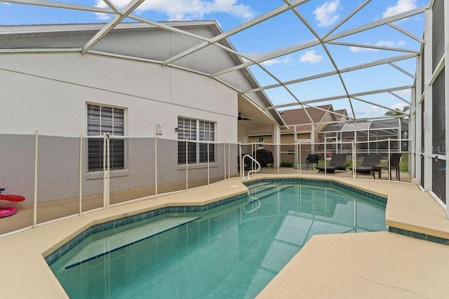 view of swimming pool with a fenced in pool, a ceiling fan, a patio, and glass enclosure