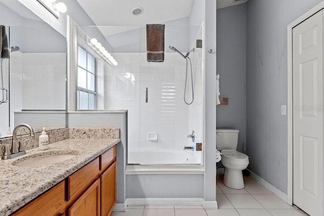 full bath featuring tile patterned floors, baseboards, bath / shower combo with glass door, vanity, and toilet