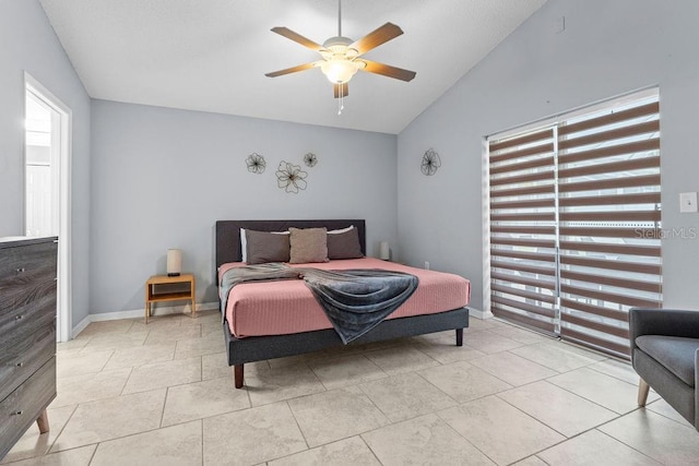 bedroom featuring a ceiling fan, lofted ceiling, and light tile patterned flooring