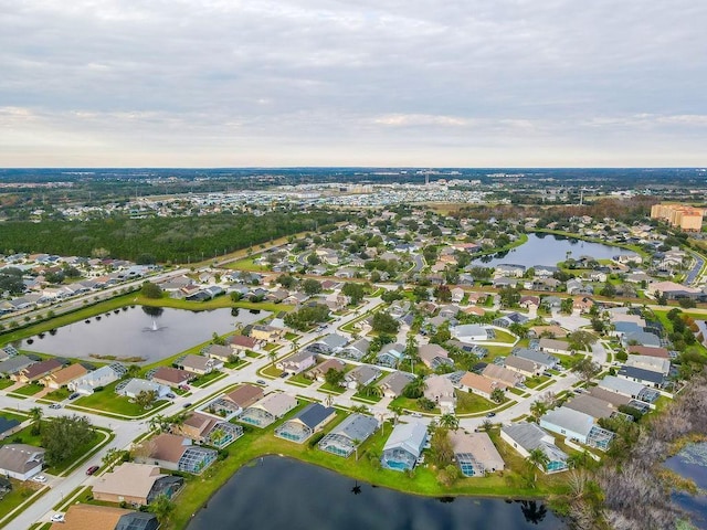 bird's eye view with a water view and a residential view