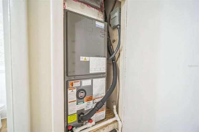 utility room with heating unit