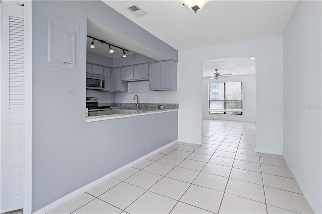 611 Casa Park A Ct, Winter Springs, FL 32708 - kitchen with stainless steel appliances, visible vents, track lighting, light countertops, and gray cabinets