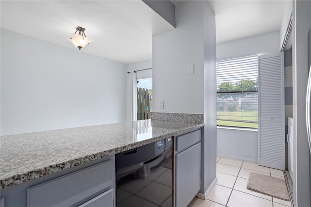 611 Casa Park A Ct, Winter Springs, FL 32708 - kitchen with gray cabinetry and light tile patterned floors
