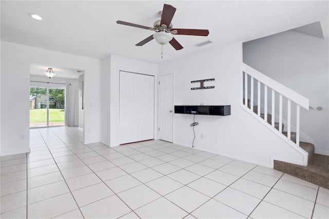 611 Casa Park A Ct, Winter Springs, FL 32708 - unfurnished living room with a ceiling fan, baseboards, light tile patterned floors, visible vents, and stairs
