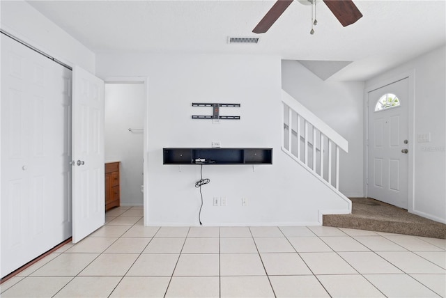 611 Casa Park A Ct, Winter Springs, FL 32708 - entrance foyer with a ceiling fan, light tile patterned floors, baseboards, visible vents, and stairway