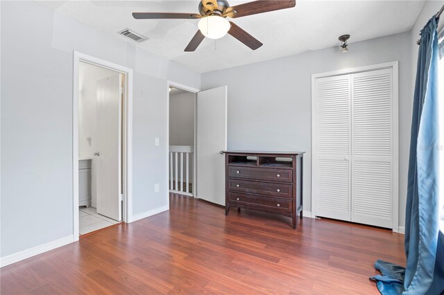 611 Casa Park A Ct, Winter Springs, FL 32708 - bedroom with a closet, wood finished floors, visible vents, ceiling fan, and baseboards