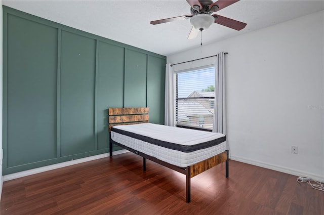 611 Casa Park A Ct, Winter Springs, FL 32708 - bedroom featuring a decorative wall, dark wood-type flooring, baseboards, and ceiling fan