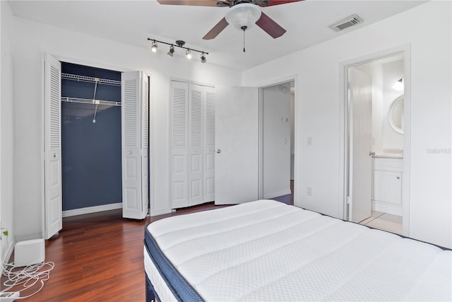 611 Casa Park A Ct, Winter Springs, FL 32708 - bedroom featuring ensuite bath, visible vents, rail lighting, two closets, and wood finished floors
