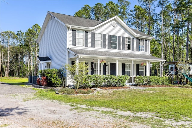 1555 Seminole Run Rd, Osteen, FL 32764 - colonial house featuring a porch, a front lawn, and cooling unit
