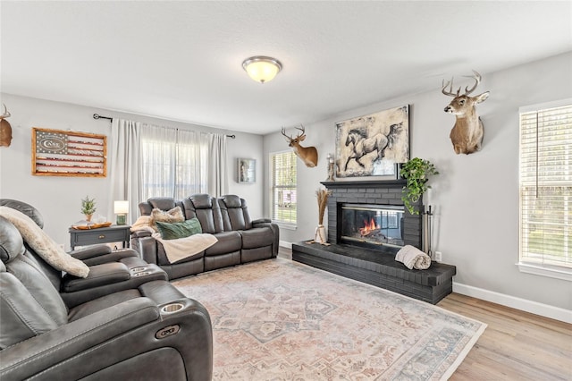 1555 Seminole Run Rd, Osteen, FL 32764 - living room with baseboards, a brick fireplace, and a healthy amount of sunlight