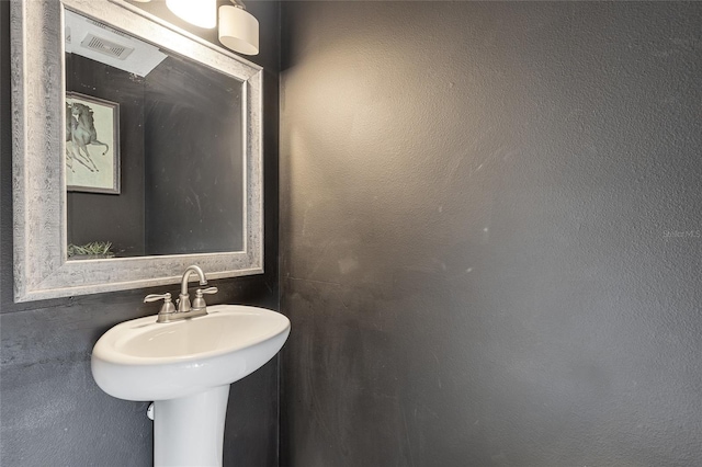 1555 Seminole Run Rd, Osteen, FL 32764 - bathroom with visible vents and a sink