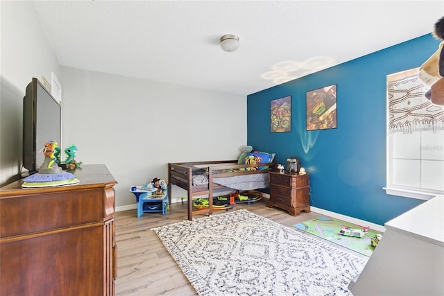 1555 Seminole Run Rd, Osteen, FL 32764 - bedroom featuring baseboards and light wood-type flooring