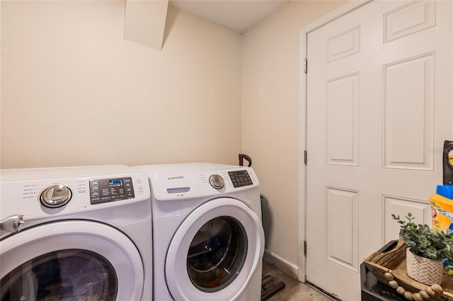 1555 Seminole Run Rd, Osteen, FL 32764 - clothes washing area with separate washer and dryer, laundry area, and baseboards