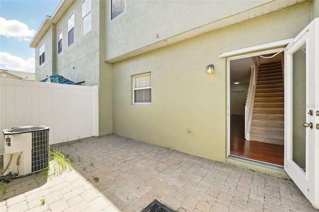 view of patio / terrace featuring fence and cooling unit