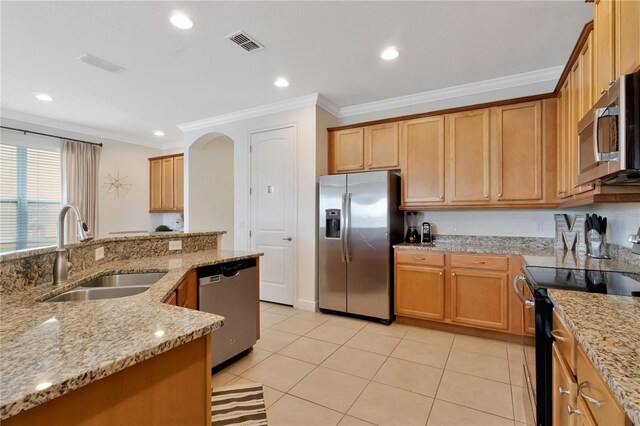 kitchen with visible vents, crown molding, light stone countertops, a sink, and appliances with stainless steel finishes