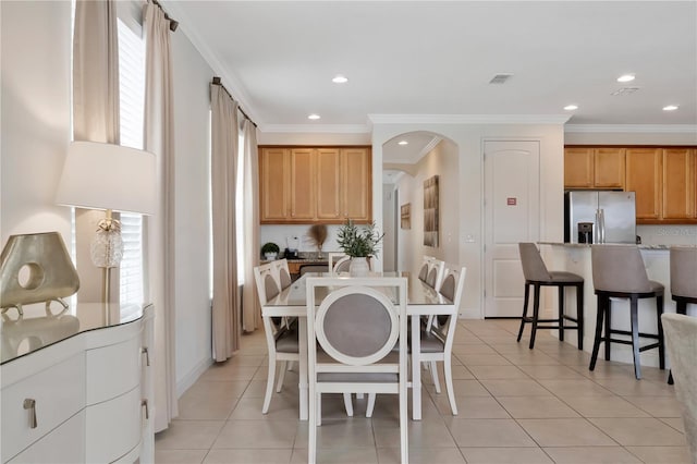 dining room featuring crown molding, recessed lighting, visible vents, and light tile patterned floors