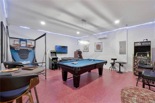 game room with wood walls, a wall mounted air conditioner, speckled floor, pool table, and electric panel