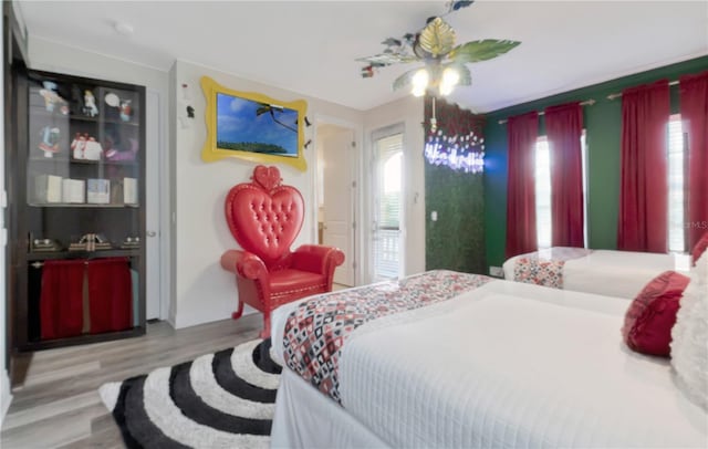 bedroom featuring a ceiling fan and wood finished floors