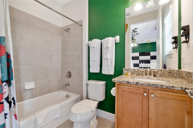 full bathroom featuring vanity, shower / tub combo with curtain, tile patterned flooring, toilet, and baseboards