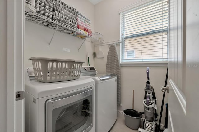 laundry area with separate washer and dryer and laundry area