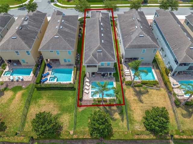 birds eye view of property with a residential view