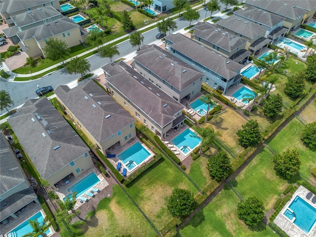 birds eye view of property with a residential view