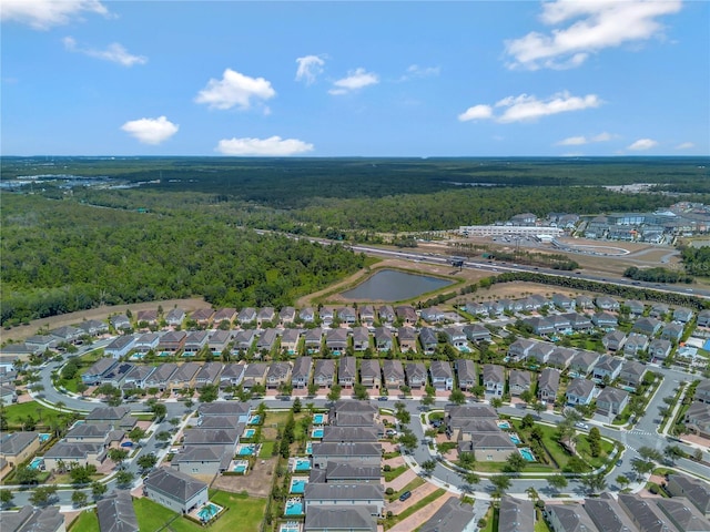 bird's eye view featuring a forest view and a residential view