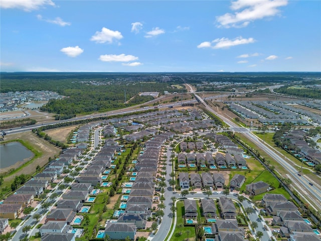 aerial view with a water view and a residential view