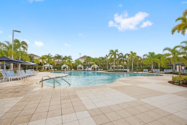 community pool featuring a patio area