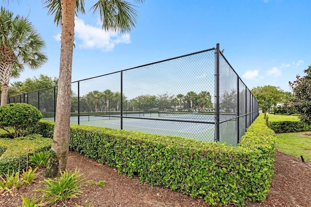 view of sport court with fence