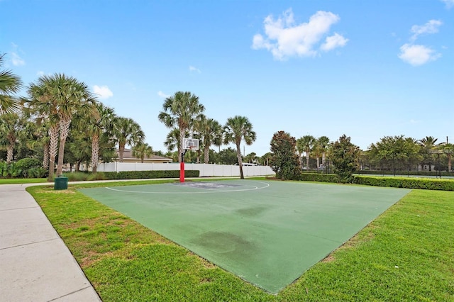view of sport court with a yard, fence, and community basketball court