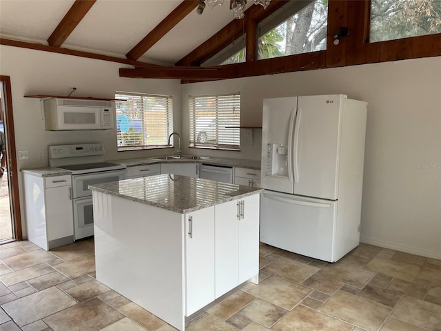 530 Webster St, Lake Mary, FL 32746 - kitchen with white appliances, a sink, a center island, and white cabinetry