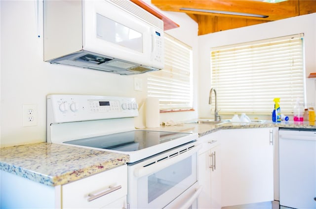530 Webster St, Lake Mary, FL 32746 - kitchen featuring white appliances, a sink, and white cabinetry