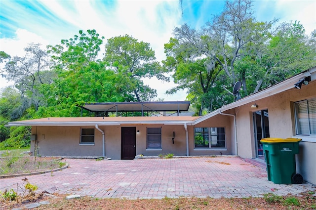 530 Webster St, Lake Mary, FL 32746 - back of house featuring stucco siding and a patio