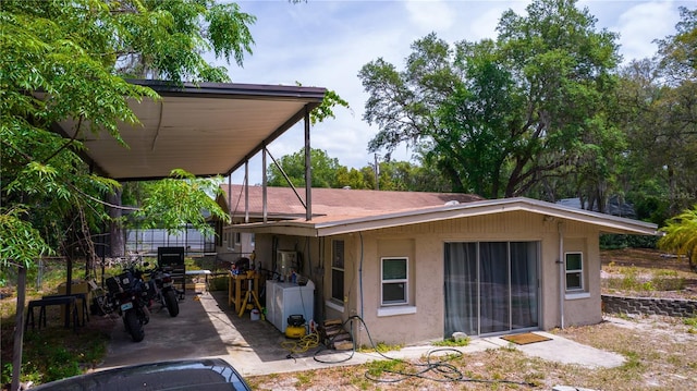 530 Webster St, Lake Mary, FL 32746 - back of house with stucco siding, a patio, and washer / clothes dryer