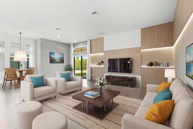 living room with visible vents and recessed lighting