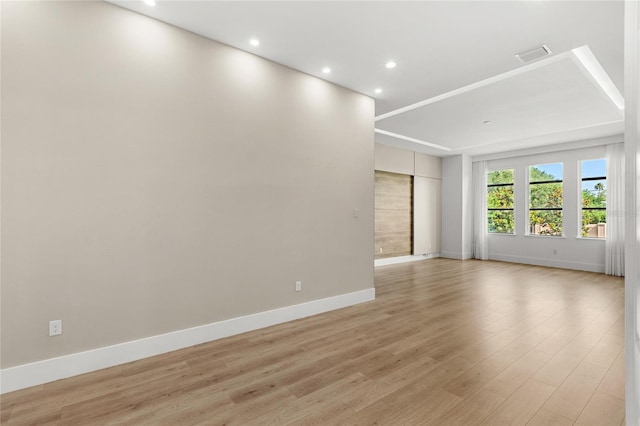 unfurnished room with baseboards, recessed lighting, light wood-style flooring, and visible vents