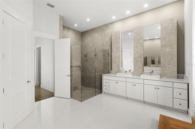 bathroom featuring a sink, walk in shower, visible vents, recessed lighting, and double vanity