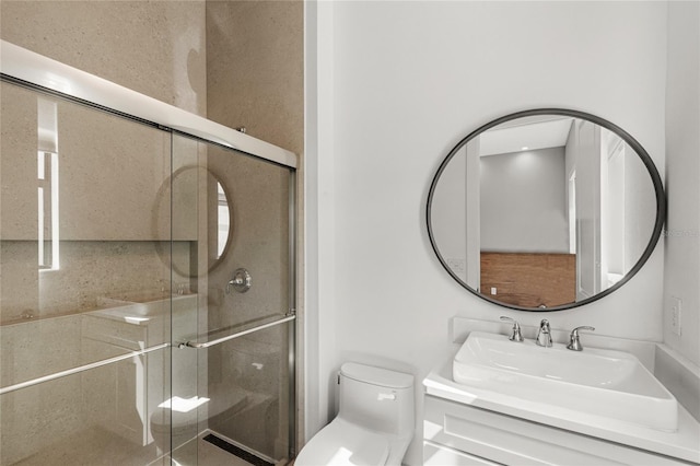 full bathroom featuring a sink, toilet, and a shower stall