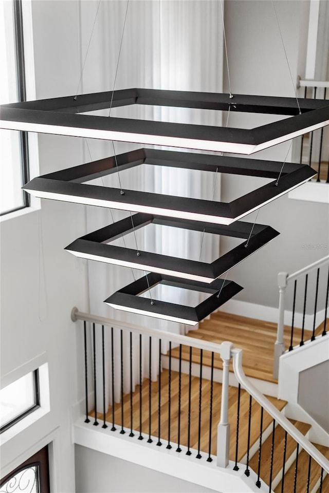 stairway featuring wood finished floors