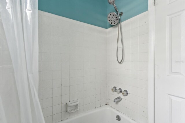 bathroom with shower / bath combo