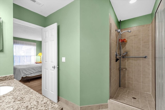 bathroom with visible vents, a sink, ensuite bath, and tiled shower