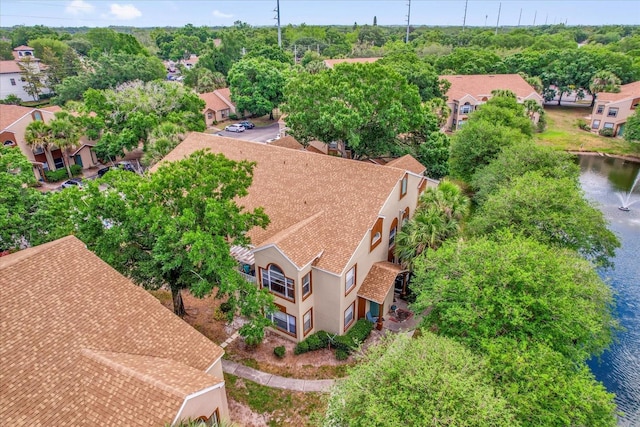 birds eye view of property with a residential view and a water view